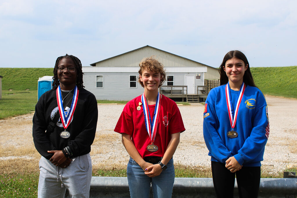 Award winners for the U17 category were: Lexi Strand, Trigger Time Shooting Education 4-H Club (1st- center), Andreyona Smith, Norview HS VA (2nd- left) and Elizabeth Gunn, American Legion Post 290 Jr Shooters Team 1 (3rd-right ).