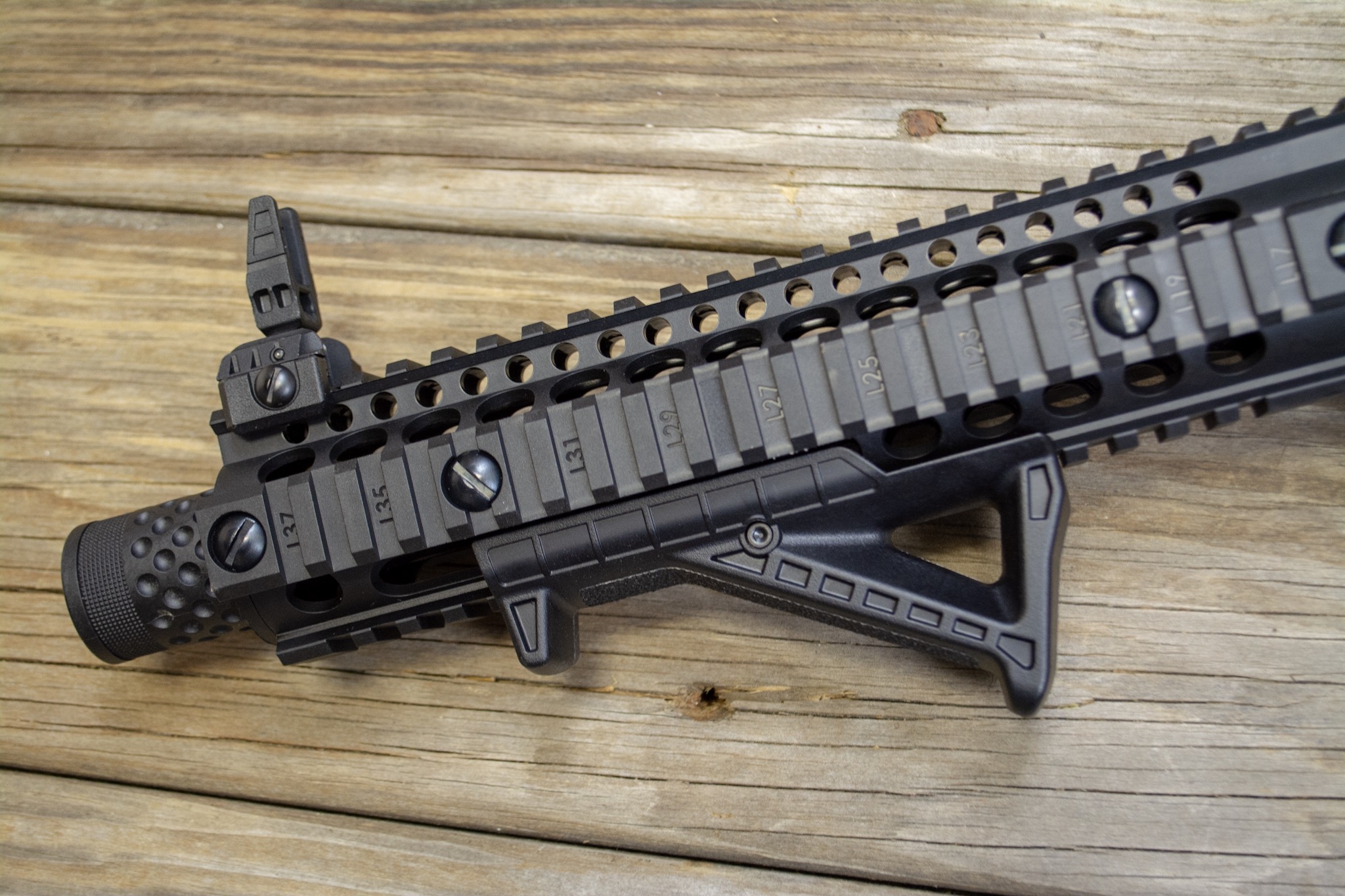 The handguard has rails all around, part of which is used for the angled grip. 