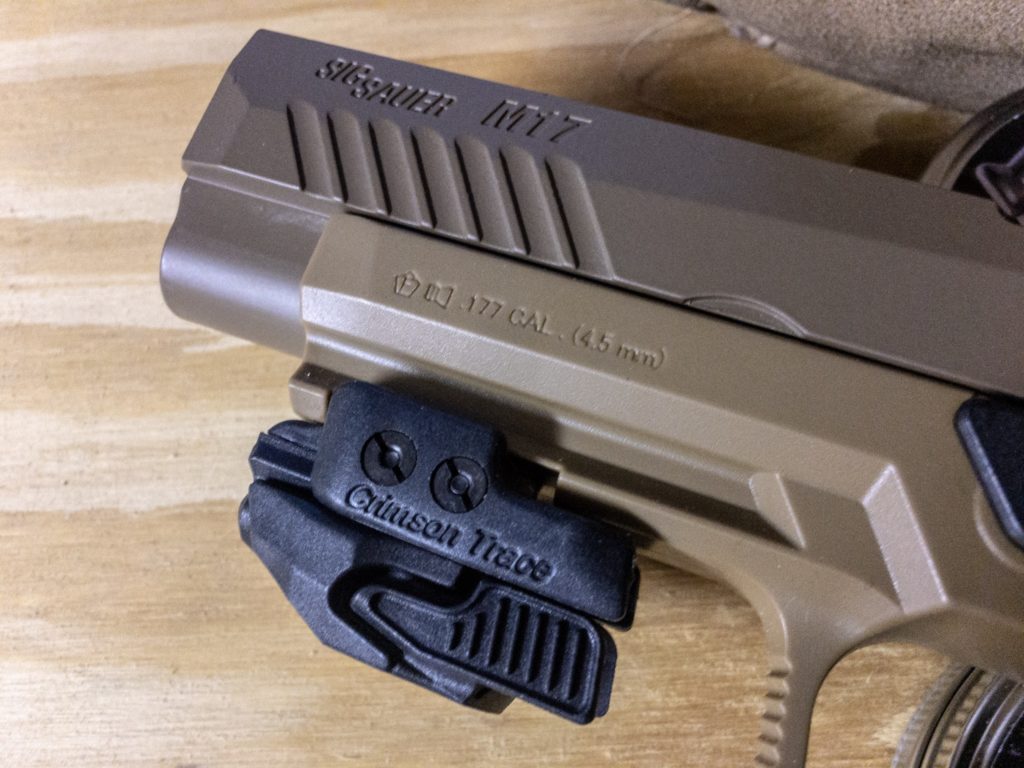You can use standard handgun accessories like this Crimson Trace laser on the Picatinny rail. 
