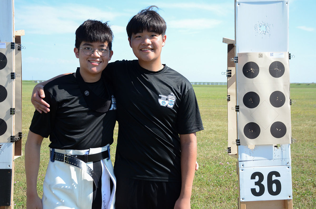 Brothers Ryan (left) and Tyler (right) compete together in air and smallbore rifle.