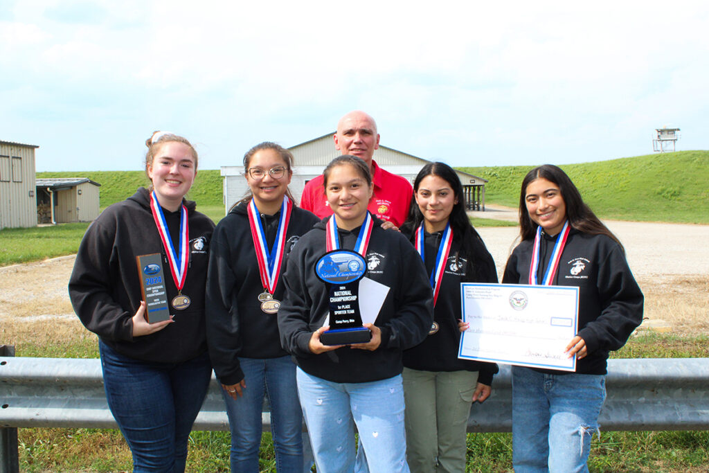 CMPSporterTeamAward24-w.jpg: Shiloh, 2nd from right, poses with her team Jack C. Hays High School in Texas. The team earned first place during the 2024 CMP National Sporter Air Rifle Championship.